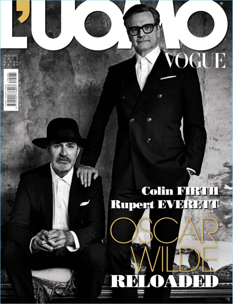 Cover of 'L'UOMO VOGUE' magazine featuring two men in suits, one sitting and the other standing, with the text 'Oscar Wilde Reloaded' and the names 'Colin Firth' and 'Rupert Everett' prominently displayed.