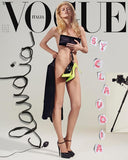 The image shows the cover of 'VOGUE Magazine Italia' August 2019 issue, featuring Claudia Schiffer. She is posed in a black and white photo with a subtle, artistic background.